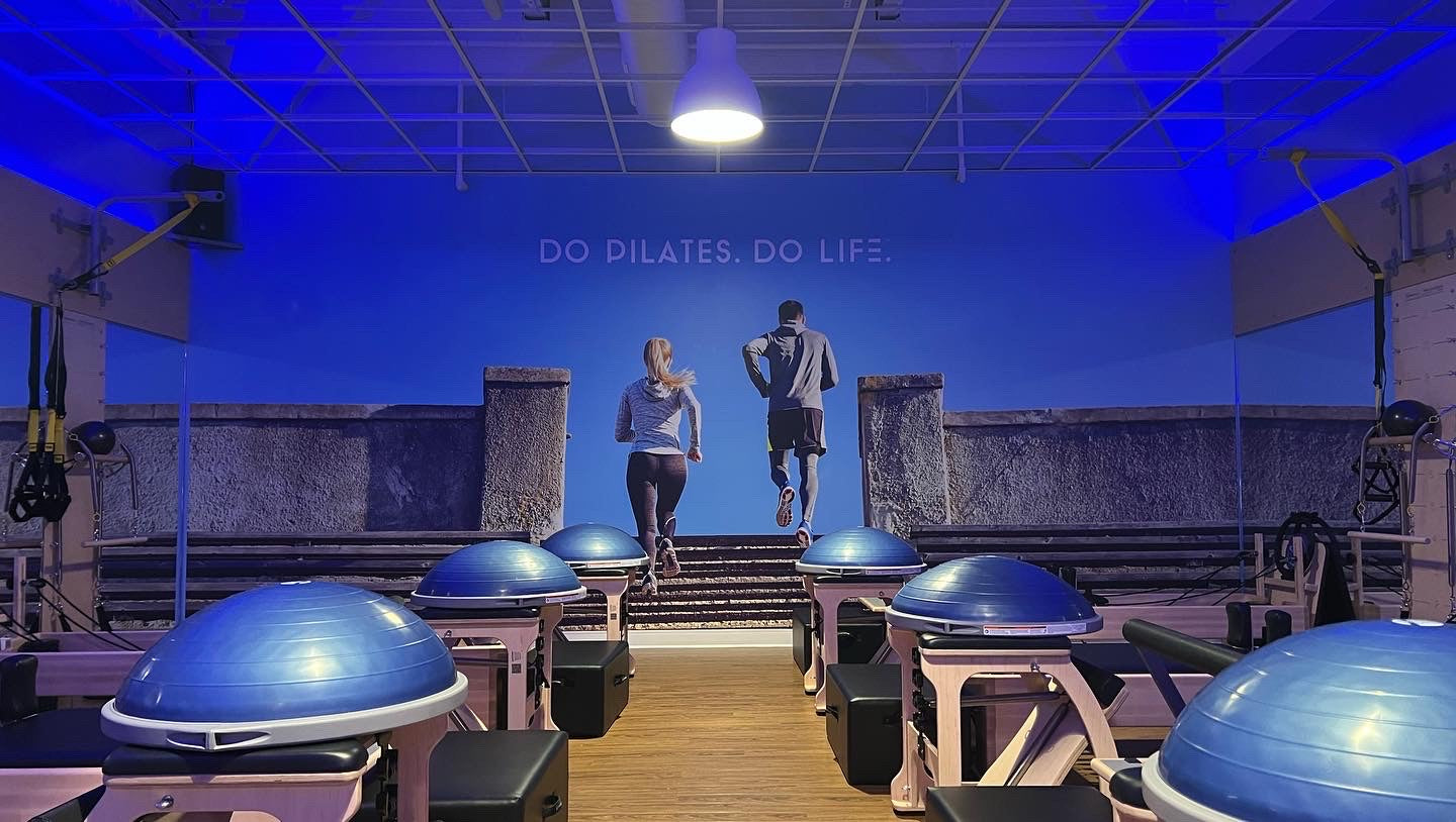 Independent Vinyl and Screen LLC vinyl decal wall mural pilates business large wall decoration people running up steps